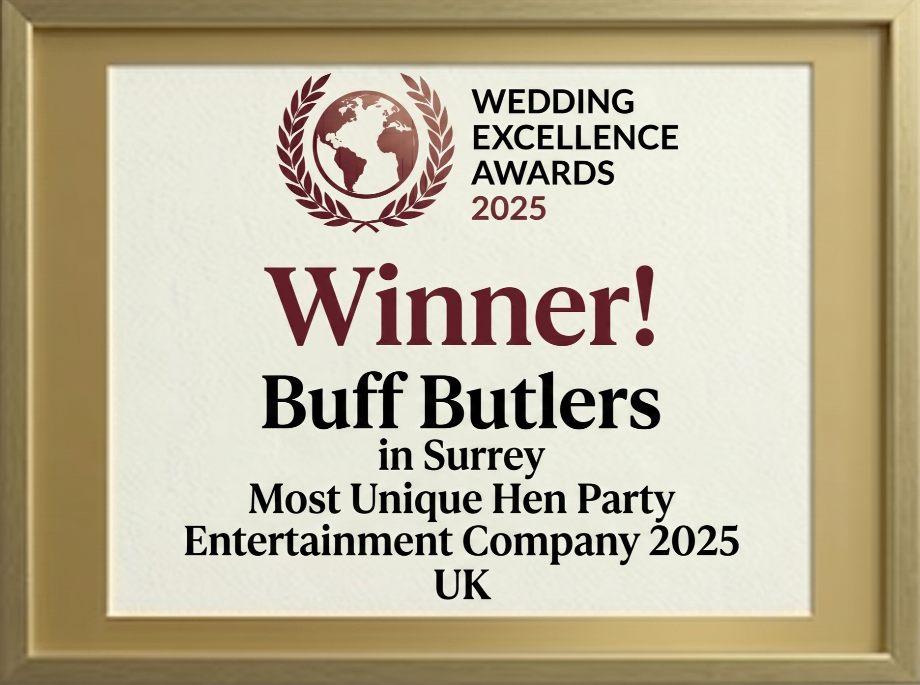 A photograph of a gold-framed 2025 Wedding Excellence Award certificate for Buff Butlers in Surrey as the Most Unique Hen Party Entertainment Company in the UK, featuring a maroon laurel globe logo